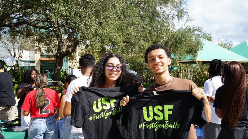 two students with branded shirts