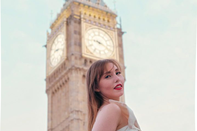 USF student, Gabrielle Sell, standing in profile in front of the Big Ben clock in London, England