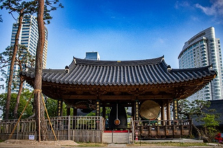 korean pagoda featured with cityscape of Seoul in the background