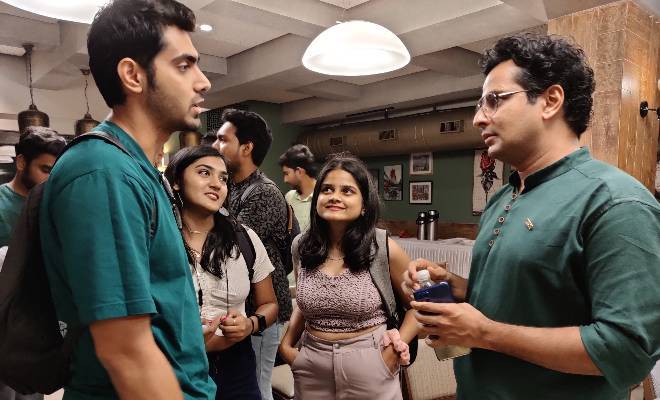USF alumnus and Indian actor, Ojas Rawal (right), speaks to incoming USF Indian students about what to expect this Fall.