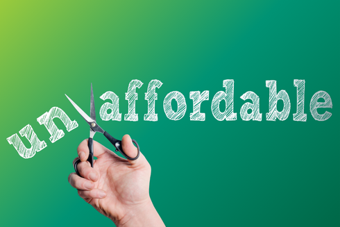 graphic of hand with scissors cutting the "un" off from "affordable"