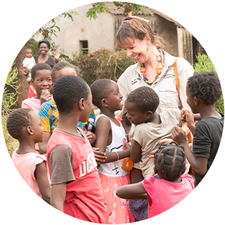 person with group of children