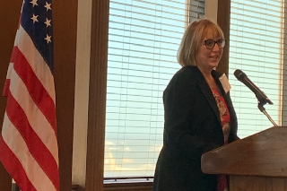 Ms. Amanda Maurer speaking at the podium after accepting the TBOWIT's annual Person of the Year award