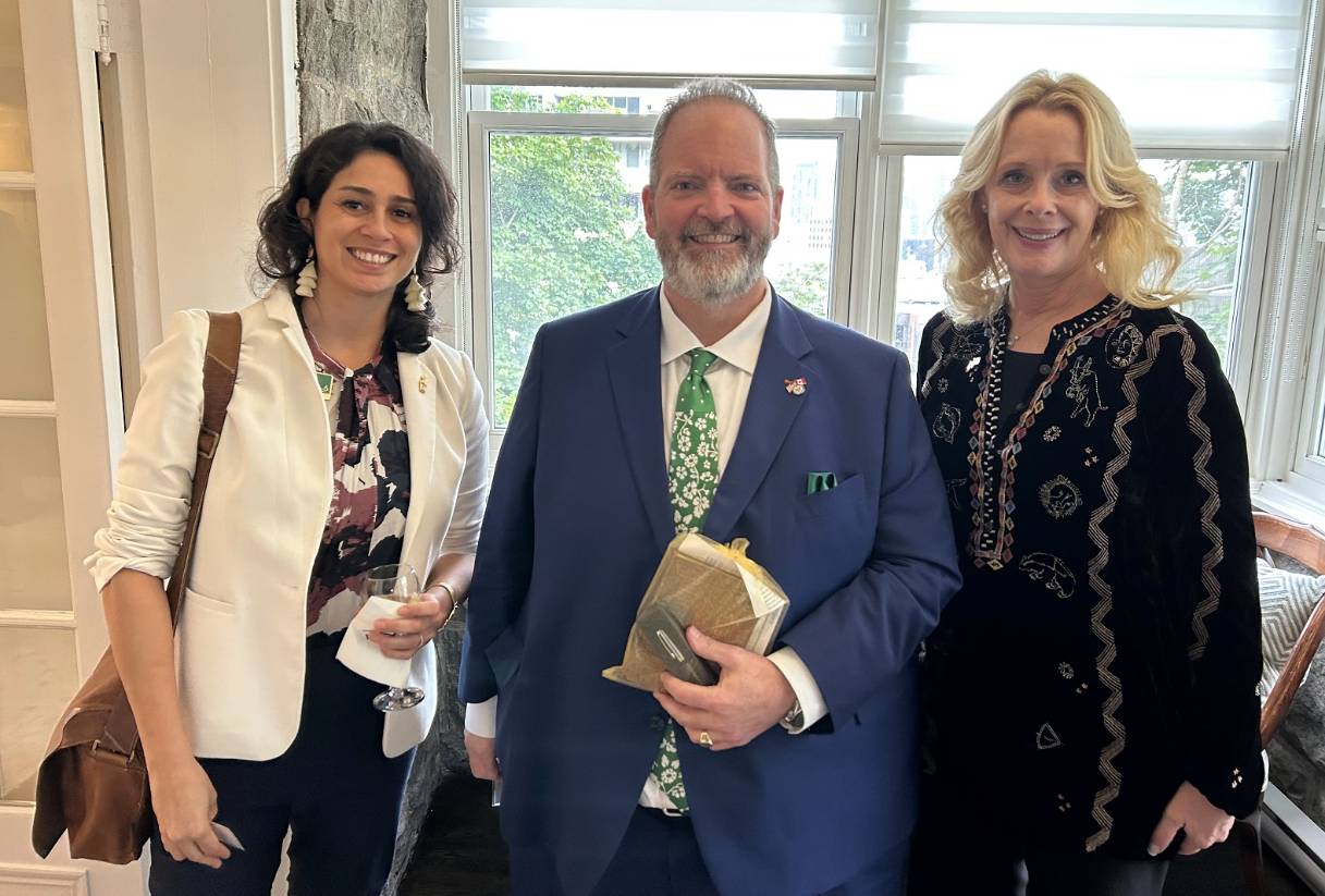 Vanessa Martinez and Kiki Caurson flanking US COnsul General Robert Sanders in Montreal, Canada.