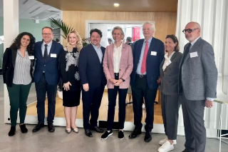 Tampa, USF, and EM Normandie Business School representatives stand for a group photo while visiting the school in Le Havre, France