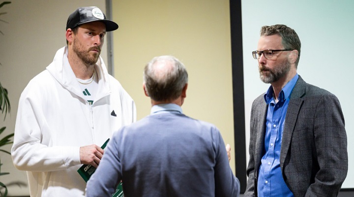 Three gentlemen - Andrew Stokes, USF Football punter; Olivier Debure, Associate Director OIS, Keith Miller, Vice-President Influxer - discussing naming, image, and likeness questio the 2024 BOOST NIL Symposium