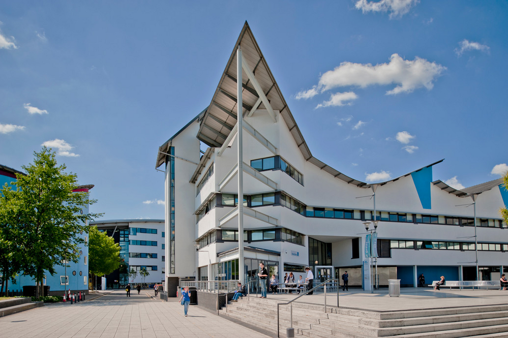 image of a modernistic white Docklands campus building of the University of East London in England