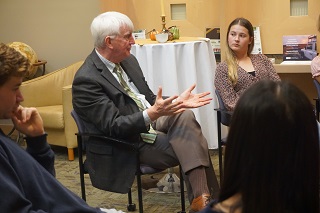 Provost WIlcox speaking with exchange students from Exeter at USF