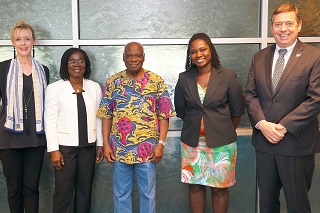 Ghana scholars visit USF. Members of USF Senior leadership posing with two female scholars from Ghana.