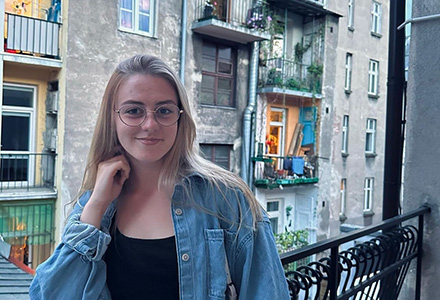 Taylor Herman stands on her balcony in Moldova. Herman traveled to Europe for a 2-week study abroad trip and came back with a deeper understanding of the Holocaust.