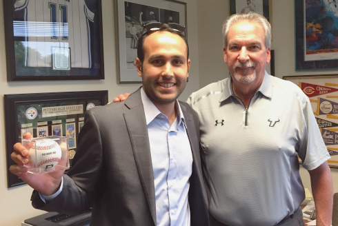 Abdullah Alabdullah holding a baseball and usf representative