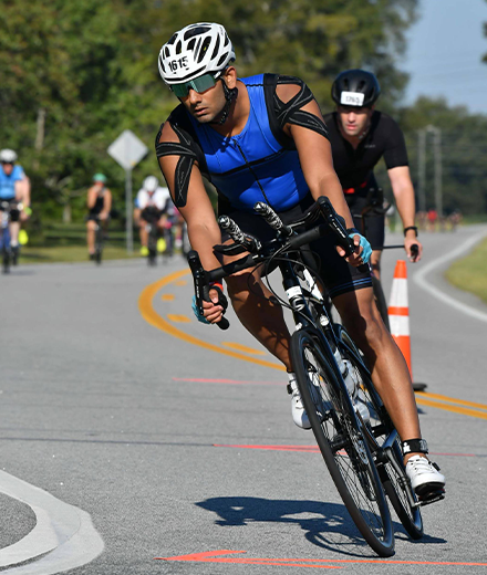 Sharma bicycling in a race