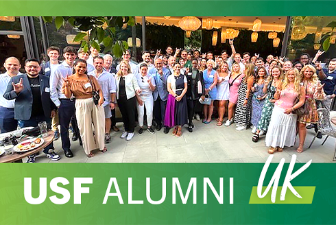 Large group of alumni smiling