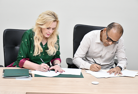 BITS Pilani and USF representatives signing an official documentther at BITS