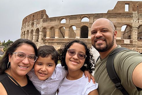 collazo family taking a group selfie in front of the colosseum