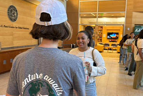 Two students talking to each other