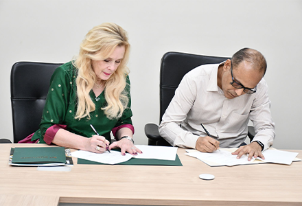 BITS Pilani and USF representatives signing an official document