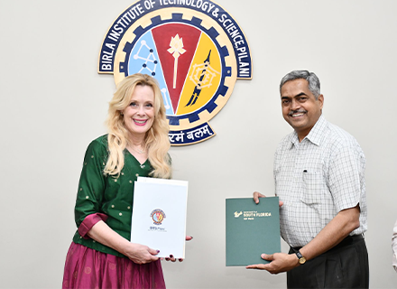 BITS and USF Representatives posing with the official documents