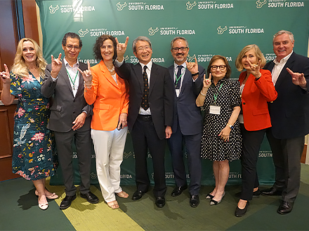 Business leaders at the USF International Business Forum pose for a group picture