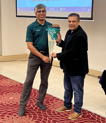 Aditya Raj Mankani gets a USF pennat from Prof Kaushik Dutta after the student session in Hyderabad
