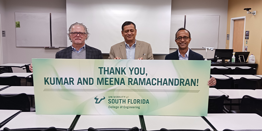 Former USF President, Judy Genshaft (left) and College of Engineering Dean, Bob Bishop (right) standing with distinguished alumnus Kumar Ramachandran (center)