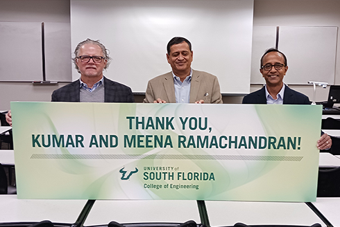Former USF President, Judy Genshaft (left) and College of Engineering Dean, Bob Bishop (right) standing with distinguished alumnus Kumar Ramachandran (center)