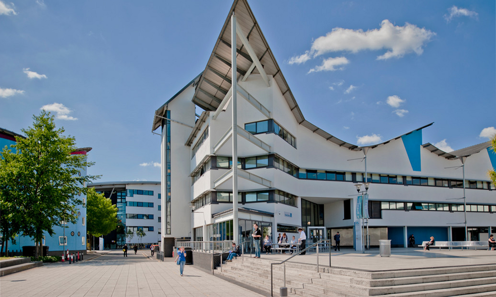 image of a modernistic white Docklands campus building of the University of East London in England
