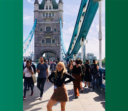 Student standing on the Tower Bridge