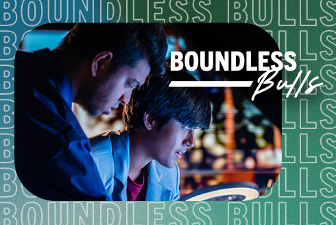 Students looking at a glowing light with a border and text that says 