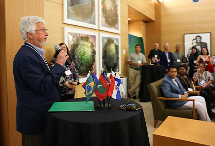 Dean of the Judy Genshaft Honors College Charles Adams speaks at gathering