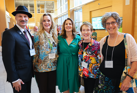 Goldberg, Caruson, Skoures, Castor, and Strom pose together, smiling