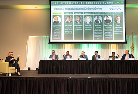 7 panelists on a stage