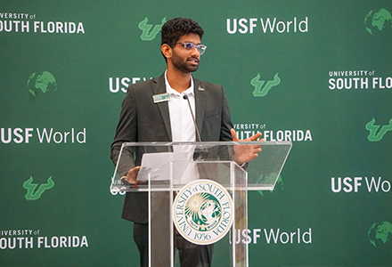 Student Government President speaking at the podium