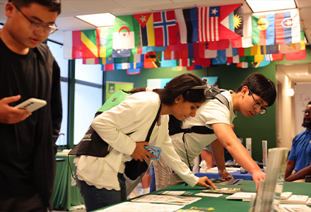 Students looking at a table with information