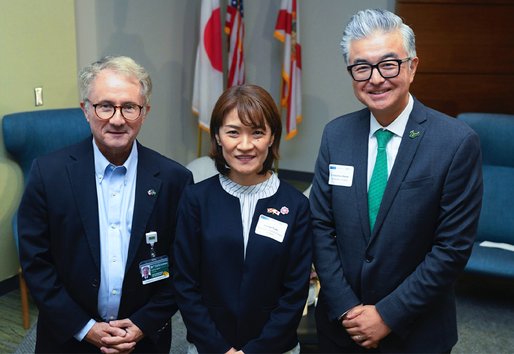 Three leaders in formal business attire