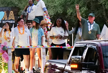 Students and Alumni on Homecoming Float at USF