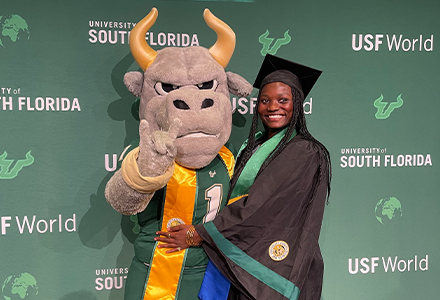 Student and Rocky the Bull Mascot