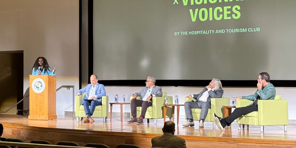 panelists with a moderator behind the podium