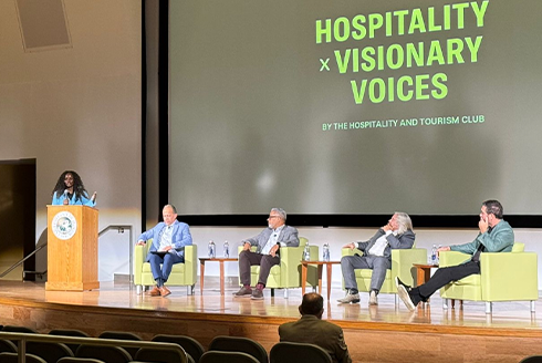 panelists with a moderator behind the podium