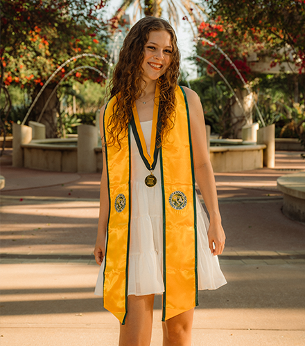 Kelsey smiling with fountain in the background