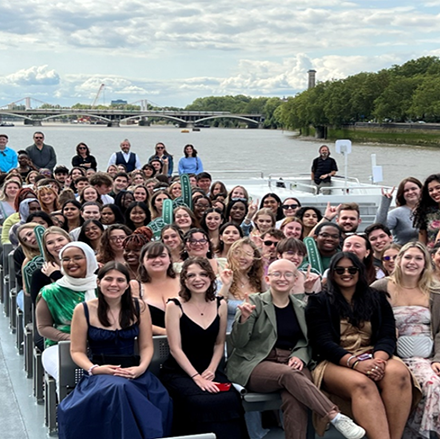 Group of students on top of a sight-seeing boat