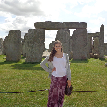 Student standing in front of Stonehenge