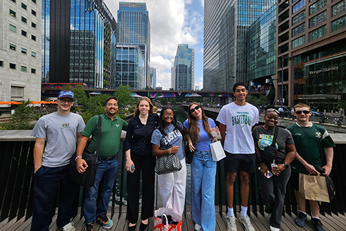 Group of people smiling in a city