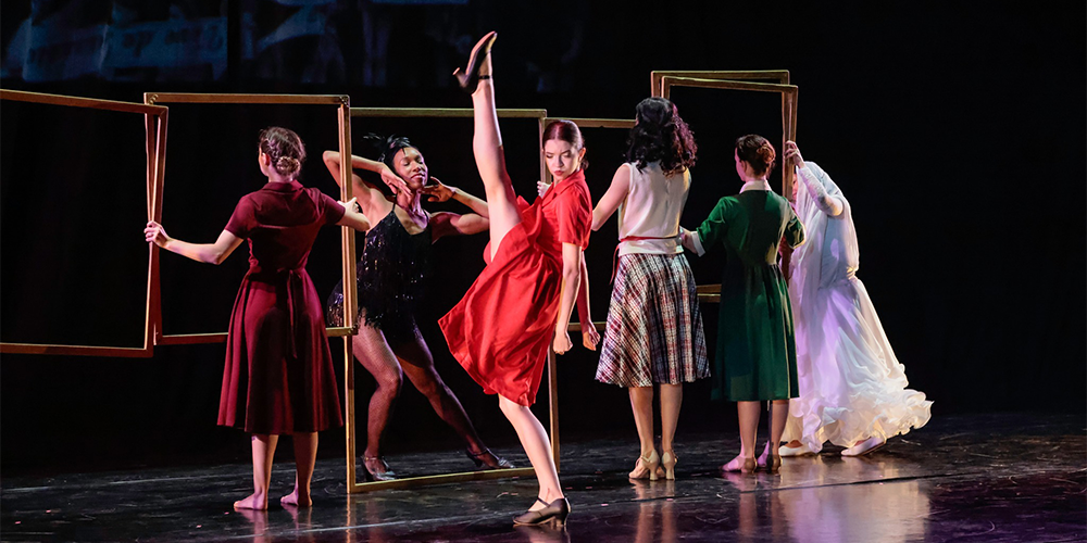 Chersia dancing with other dancers in the background