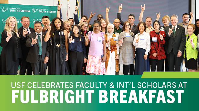 photo of group of people with hands up in bulls symbol