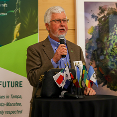Dean Charles Adams speaking
