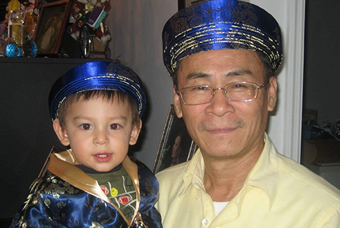 Grandfather holding baby grandson