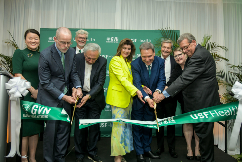 Leaders of USF and the Global Virus Network cutting the ceremonial ribbon.