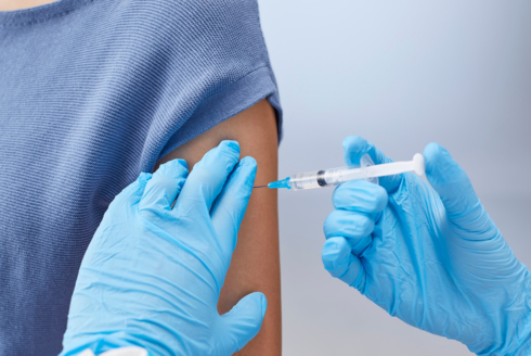 doctor inserting needle