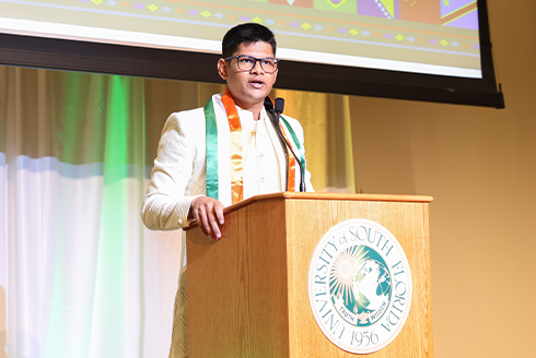 Jadhav speaks at podium